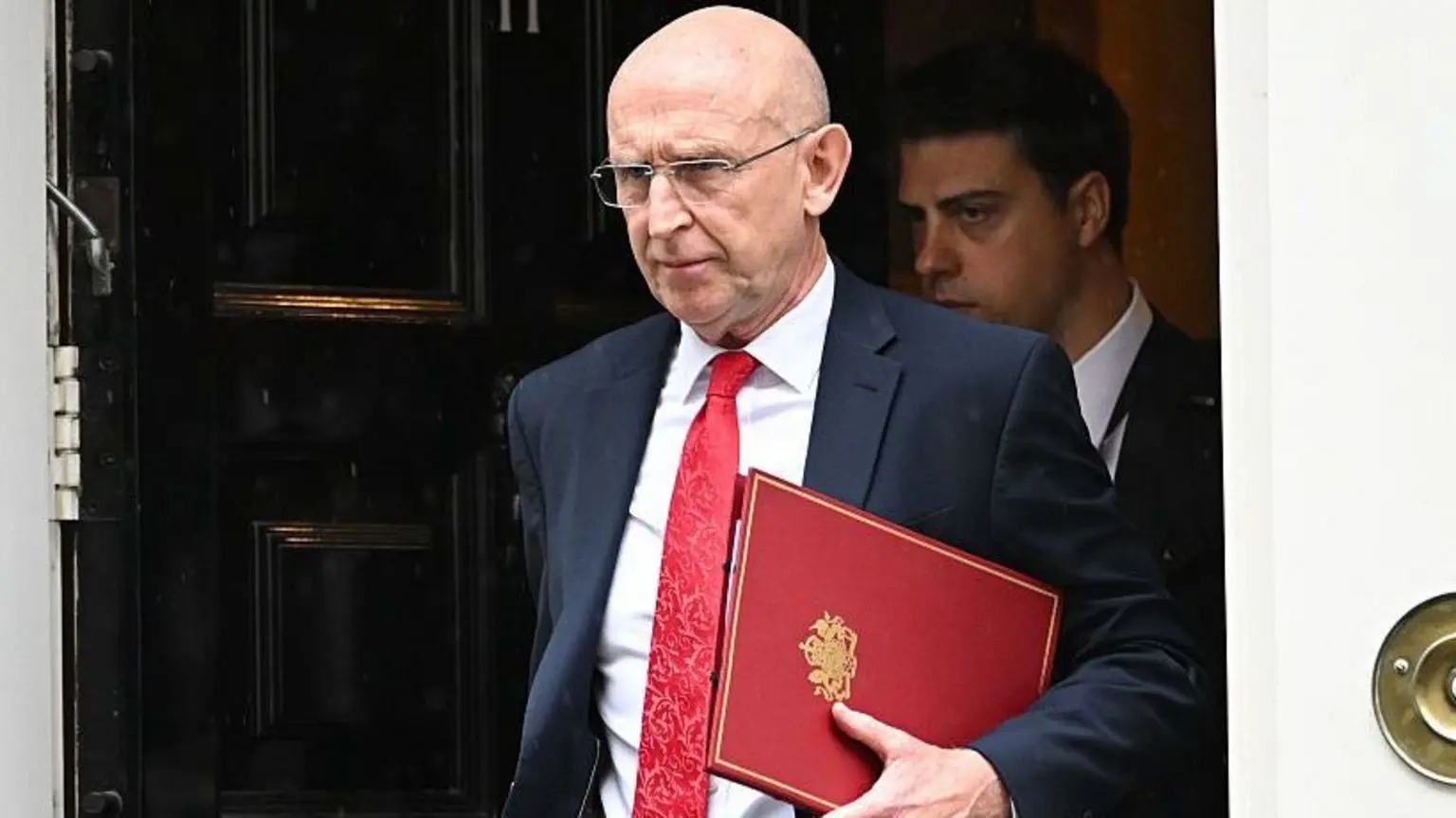 Chancellor John Healey walks out of a cabinet meeting at Number 10 Downing Street